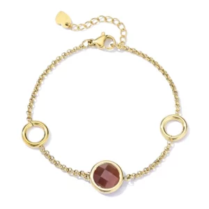Goudkleurige armband Laure met een ronde bruine cat’s eye steen, twee open cirkels en een verlengkettinkje
